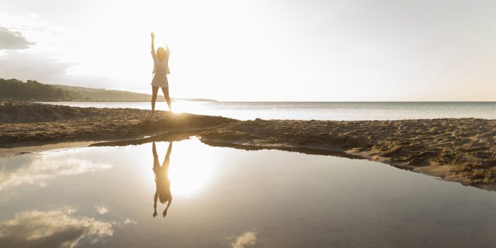 front-view-woman-posing-outdoors-with-water